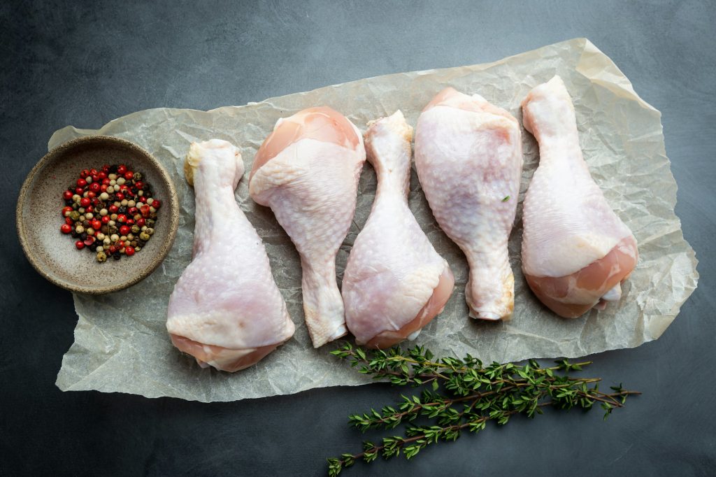 Raw chicken drumsticks